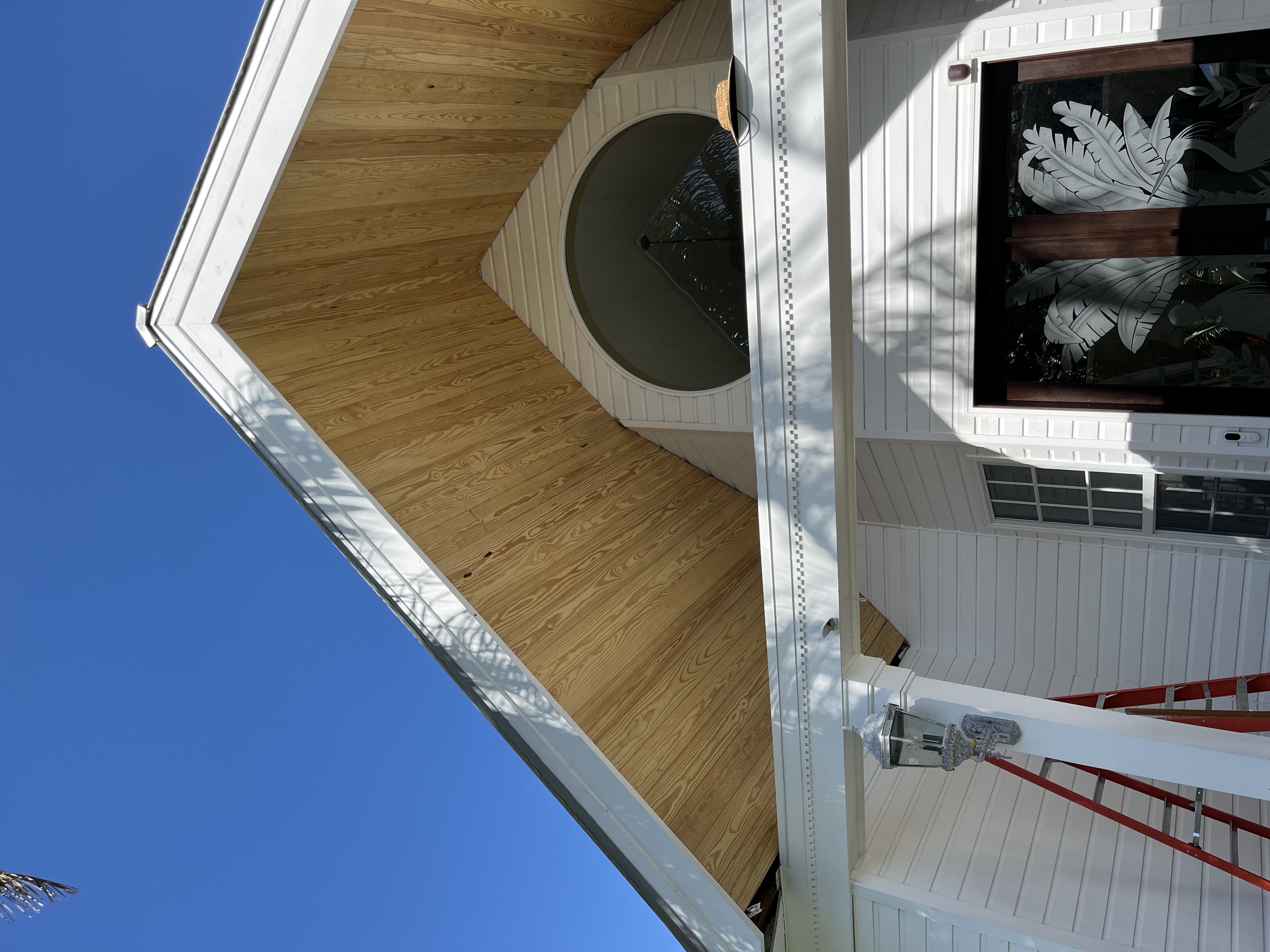 Tongue and groove gable ceiling nearly complete with the wood pattern fully visible