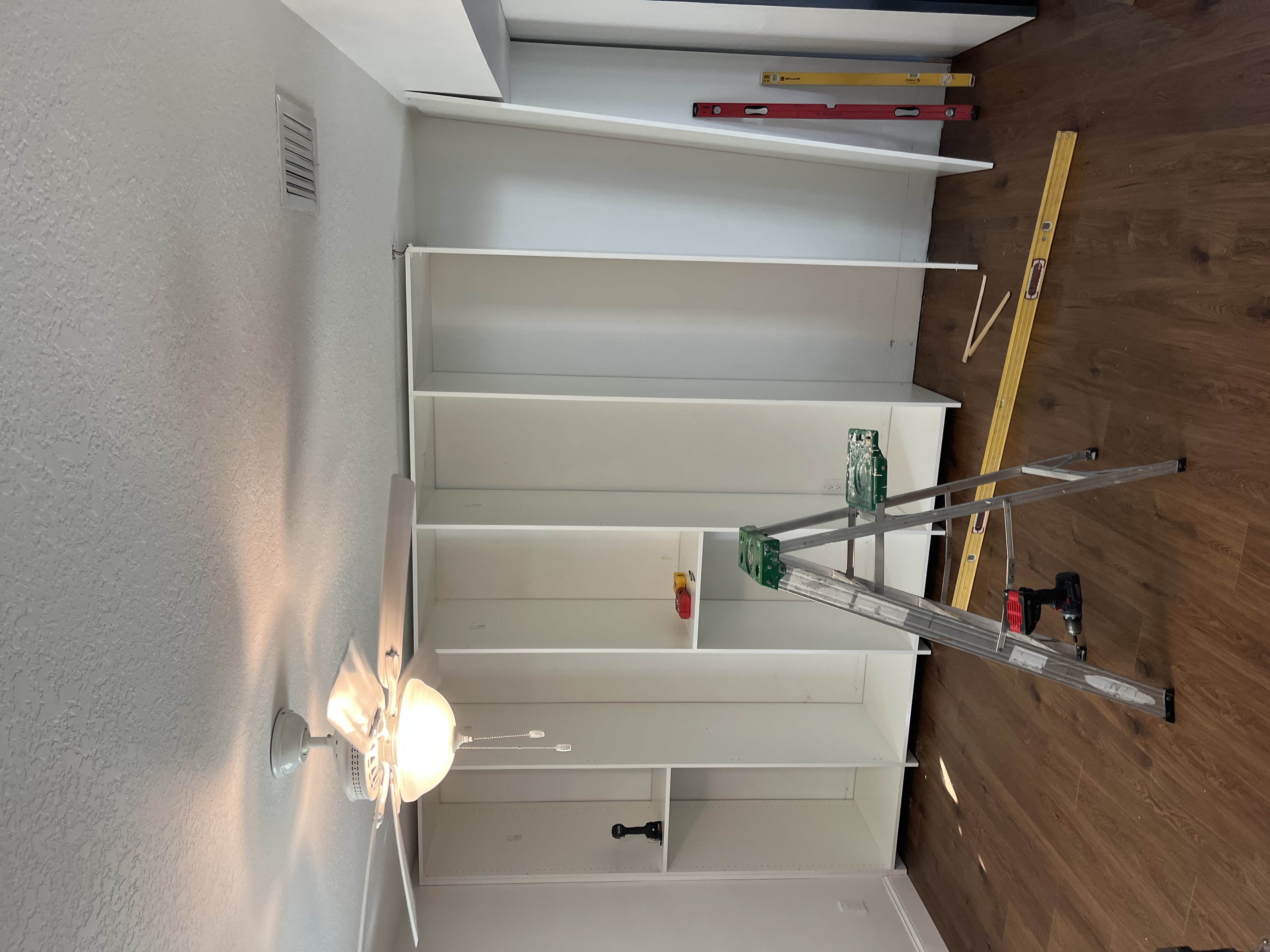 Before photo of a custom closet project while shelving is being assembled