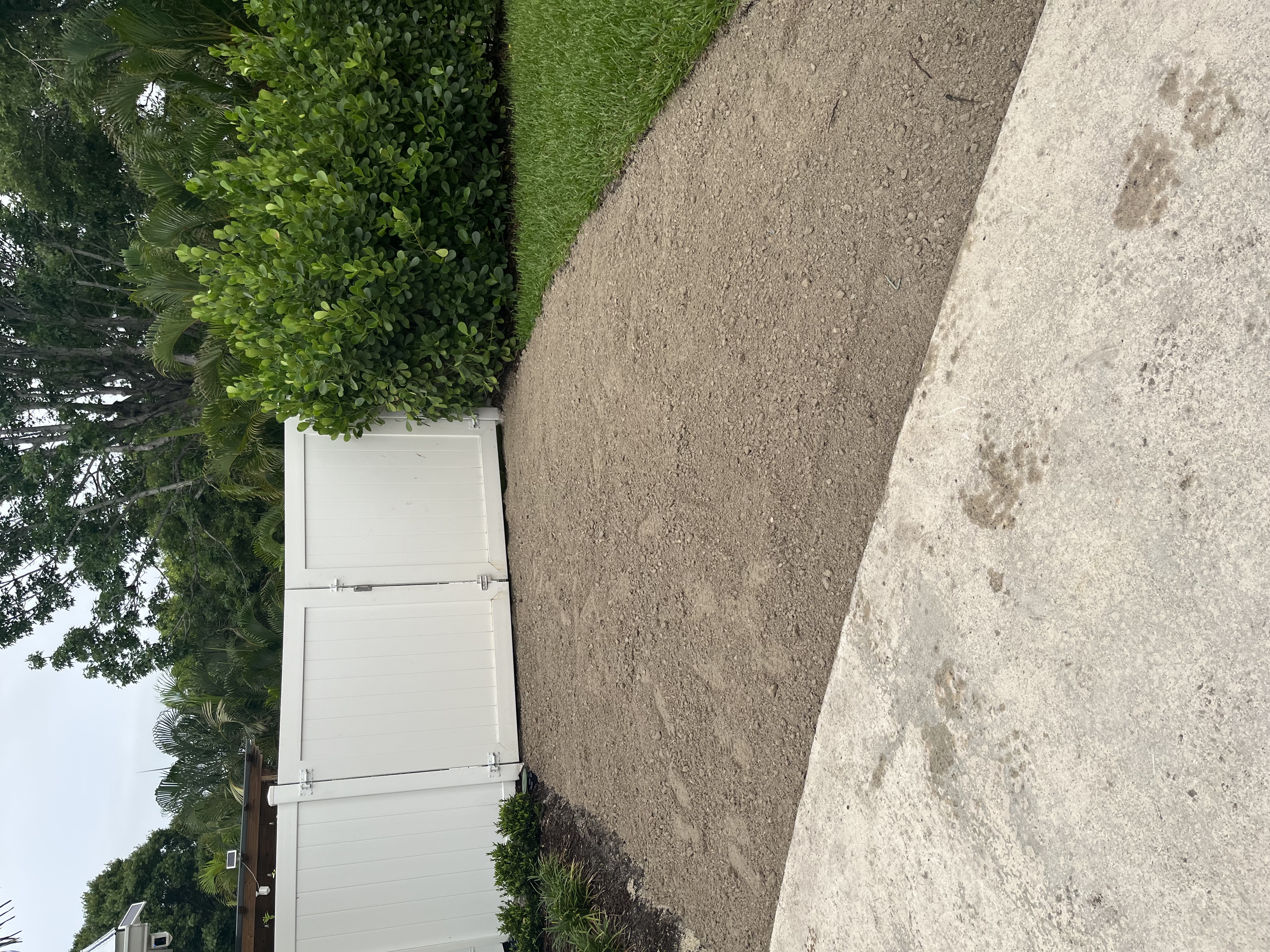 Prepared base spread evenly across the side yard before reinforcement was added