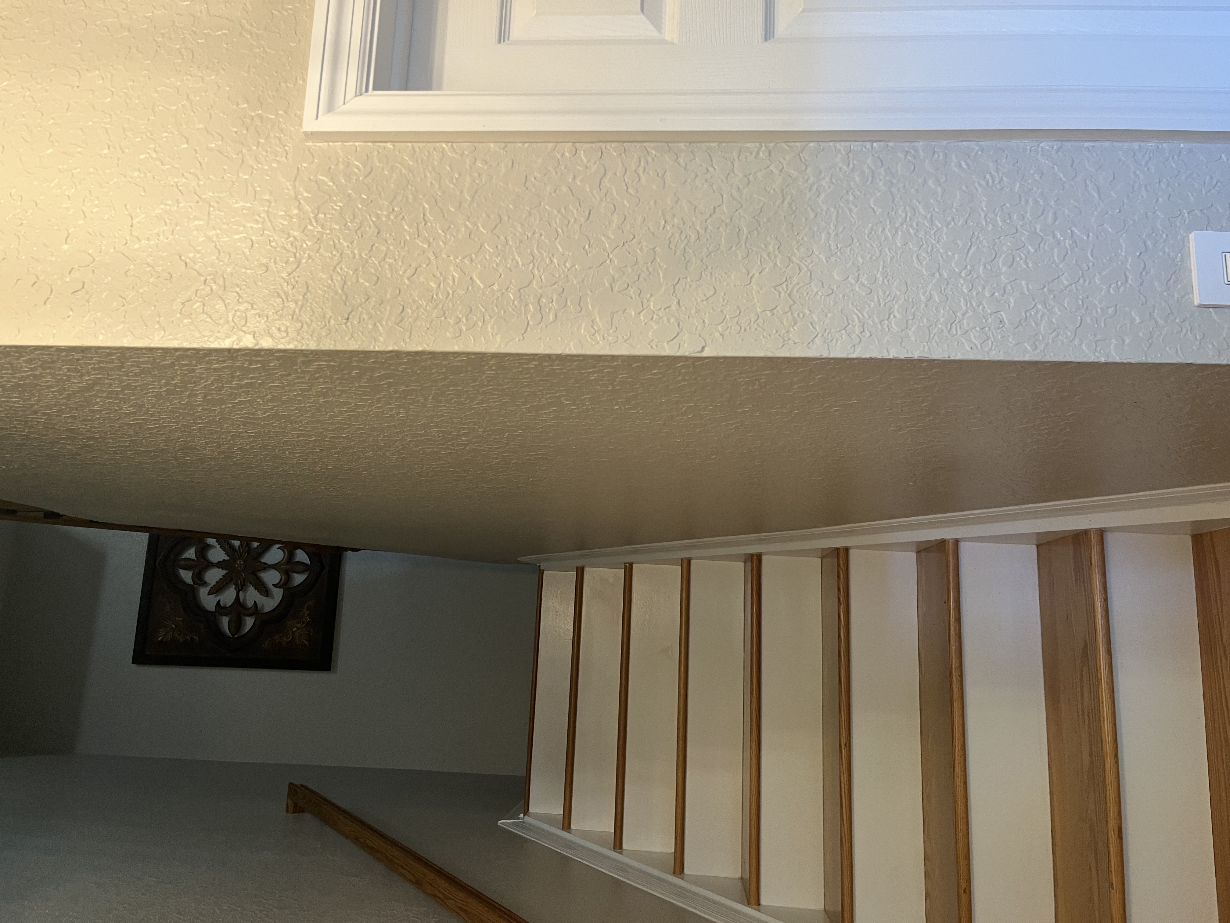 Early stage of a stairwell wall paneling project before the finish trim and final paint