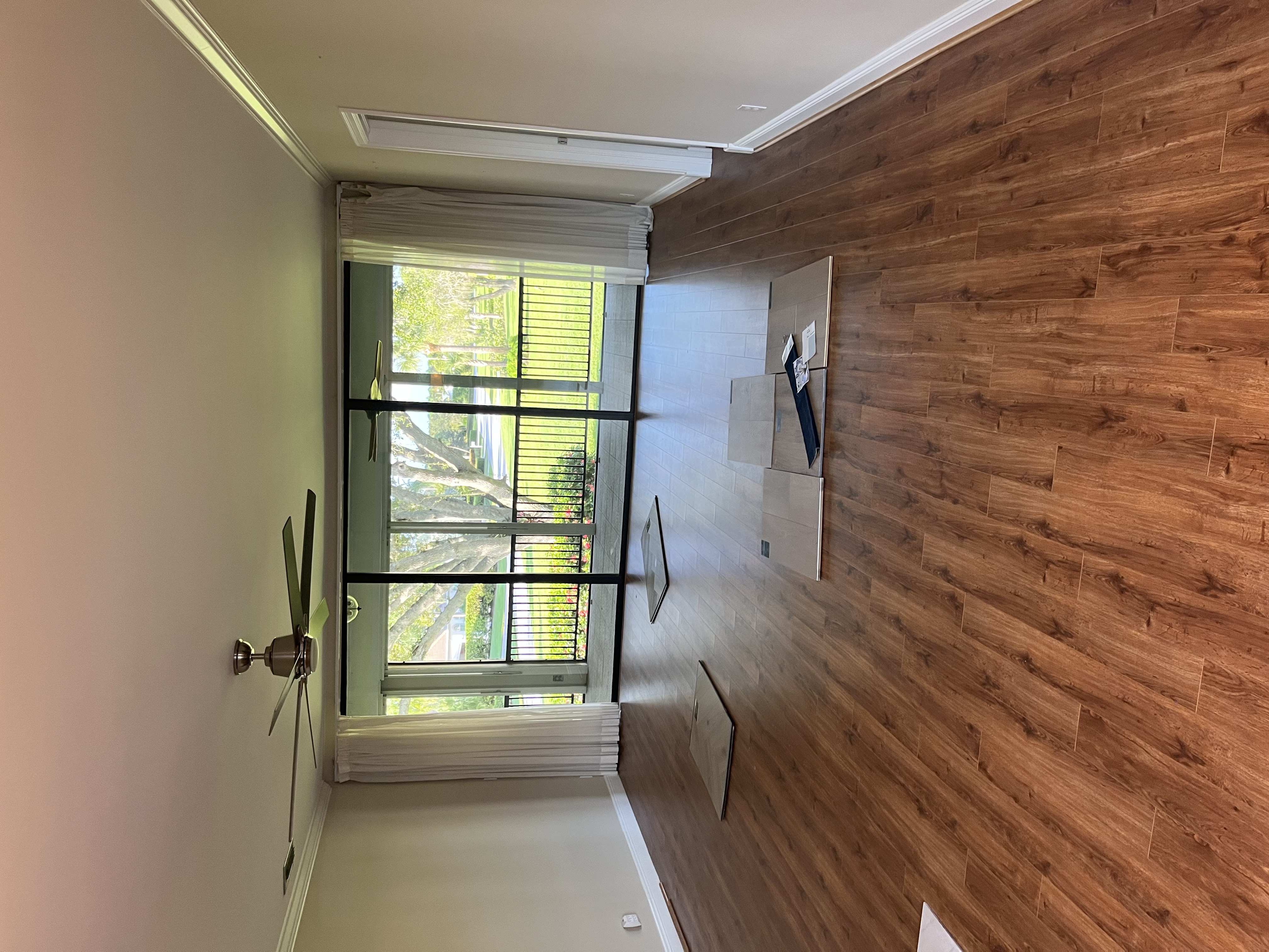 Before photo of a room with exposed concrete flooring before installation